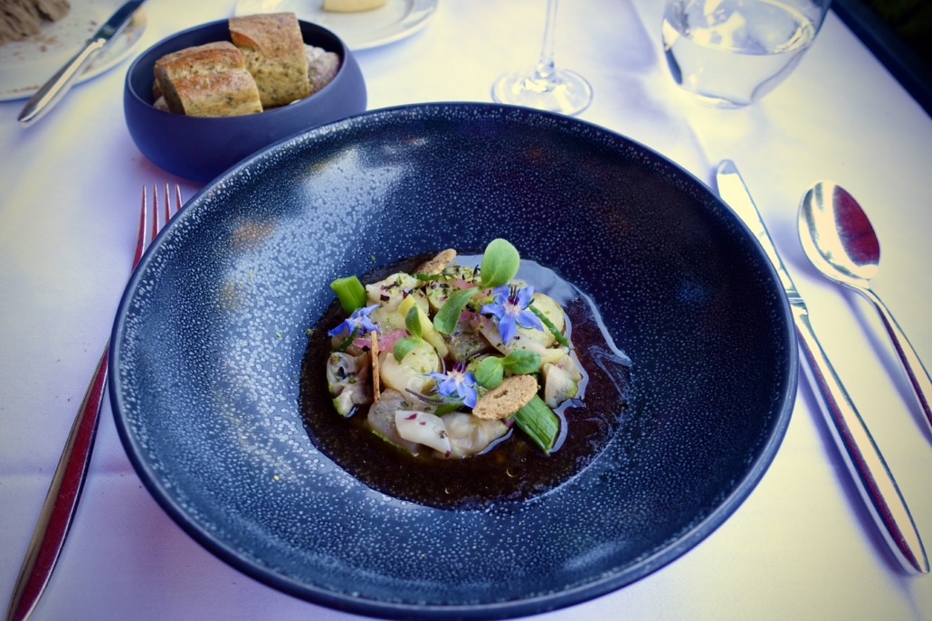 lake whitefish & shellfish with smoked onion broth at Restaurant Le Jardin at Hotel Le Richemond Geneva