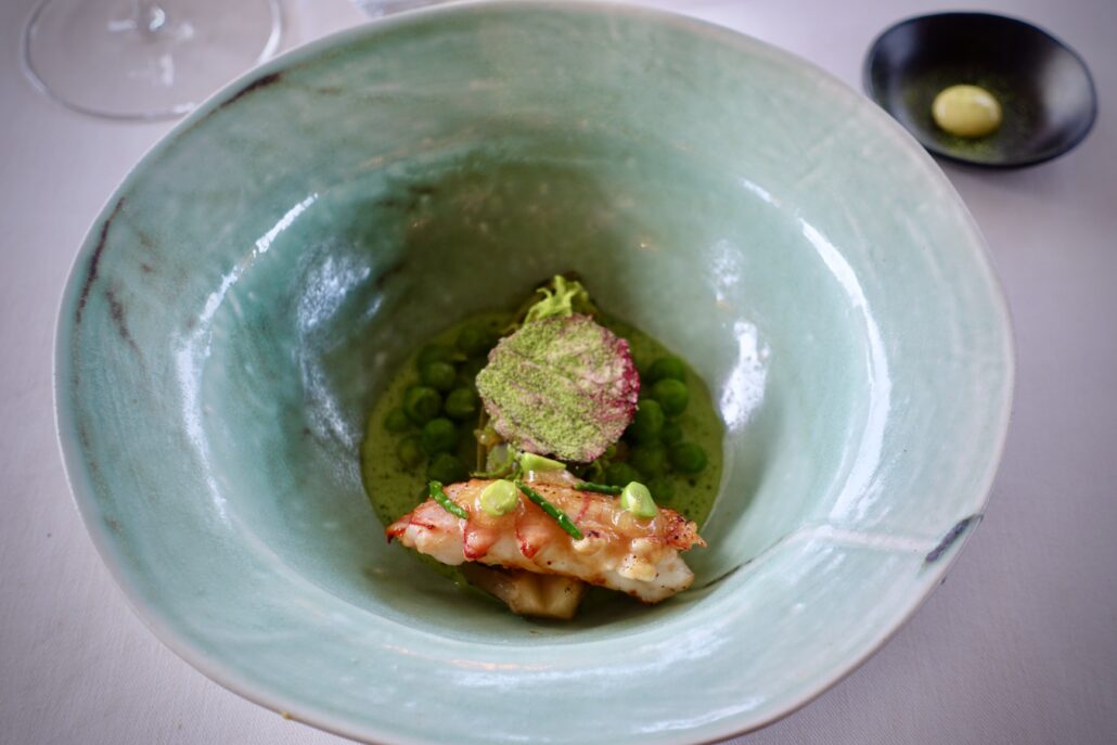 scampi with with green peas, grapefruits and Romaine lettuce at Restaurant Incantare Heiden Switzerland