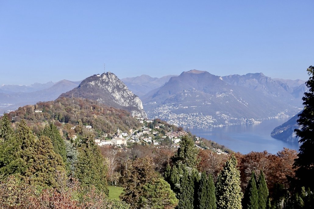 Lugano Switzerland: view of Monte San Salvatore (mountain in the front w/broadcasting station) & Monte Bré (populated mountain in the back) from Carona