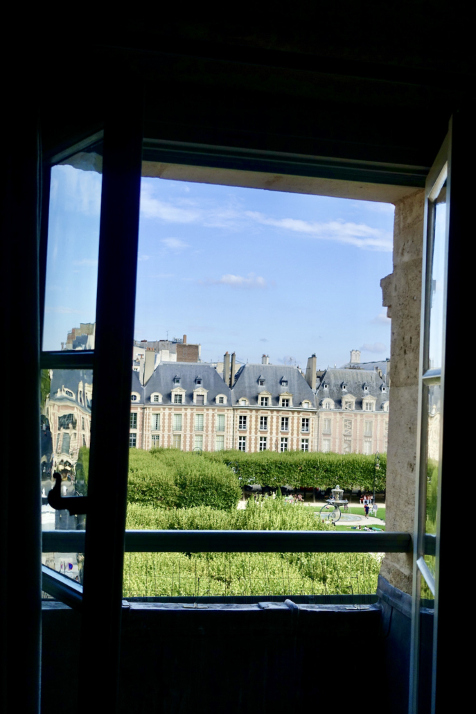 view of Place des Vosges from Deluxe Room at Hotel Cour des Vosges Paris