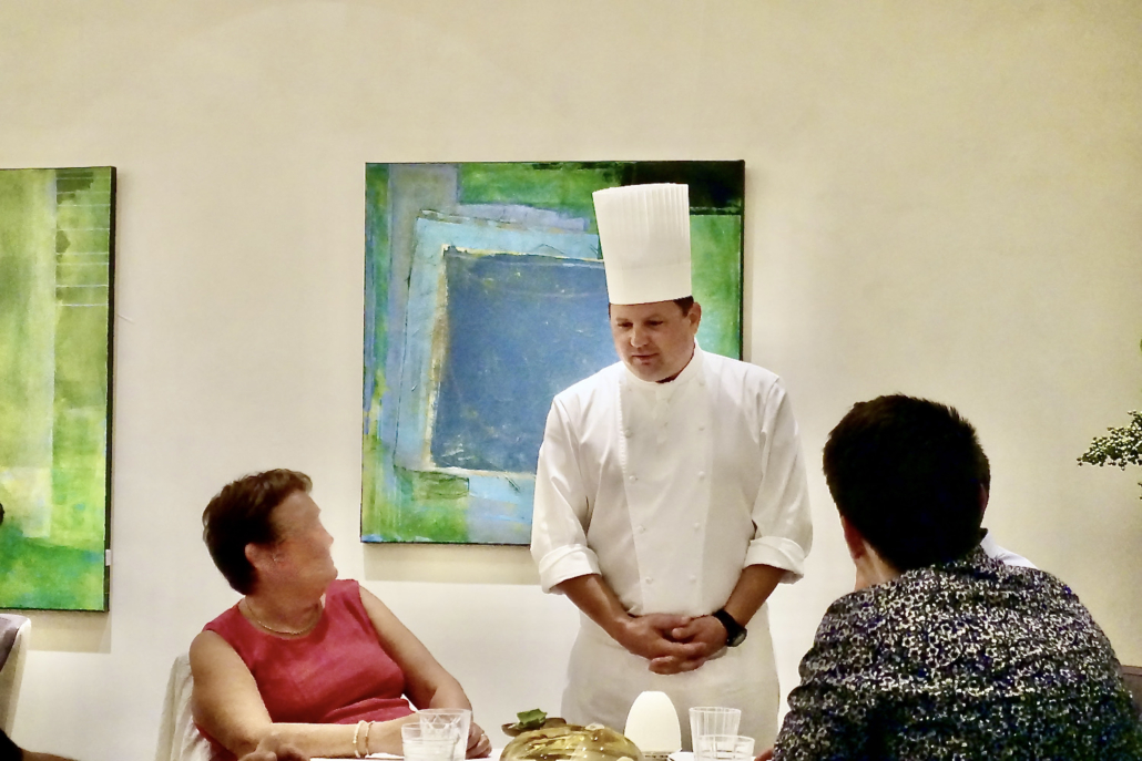 chef Franck Giovannini talking to guests at 3-star Michelin Restaurant Hôtel de Ville Crissier Switzerland