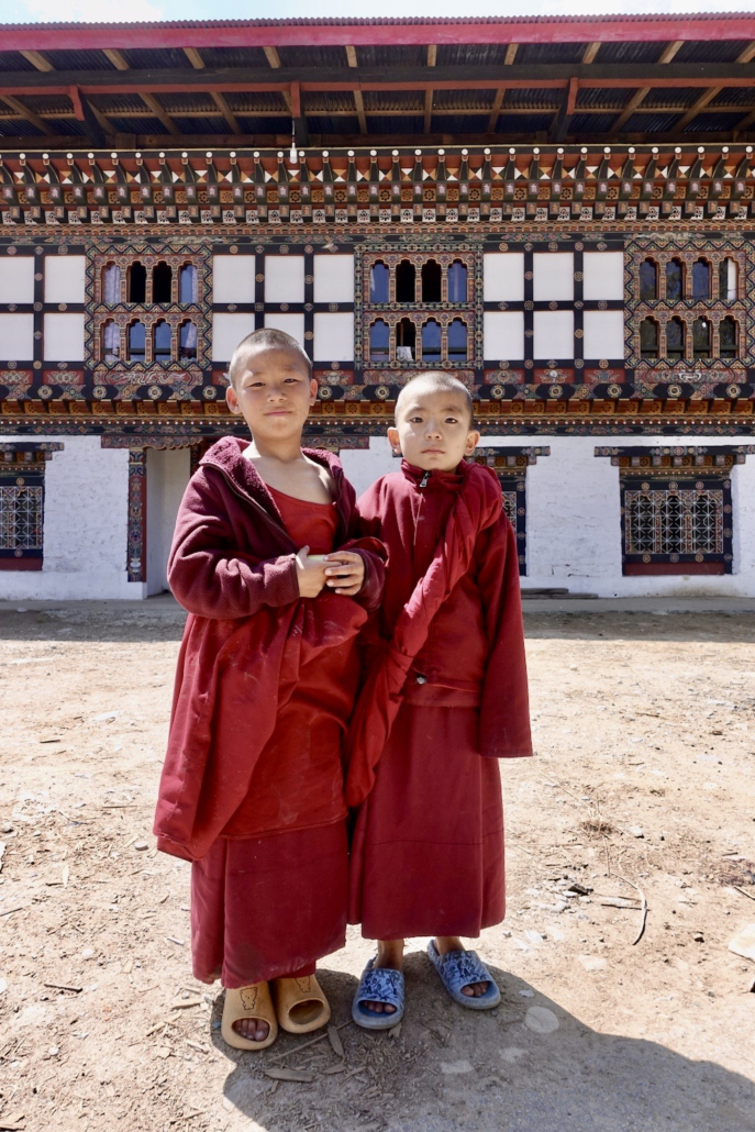 2 young Buddhist monks in Bhutan - Bhutan travel guide